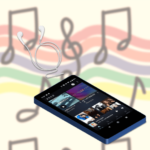 Amazon Musicのアプリを開いたスマホとイヤホン